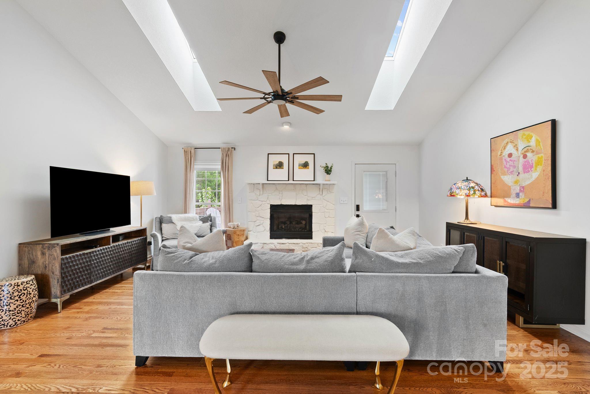 6 Sayles Town Road Fairview, NC 28730 - Photo 12 of 43 a living room with furniture a flat screen tv and a fireplace