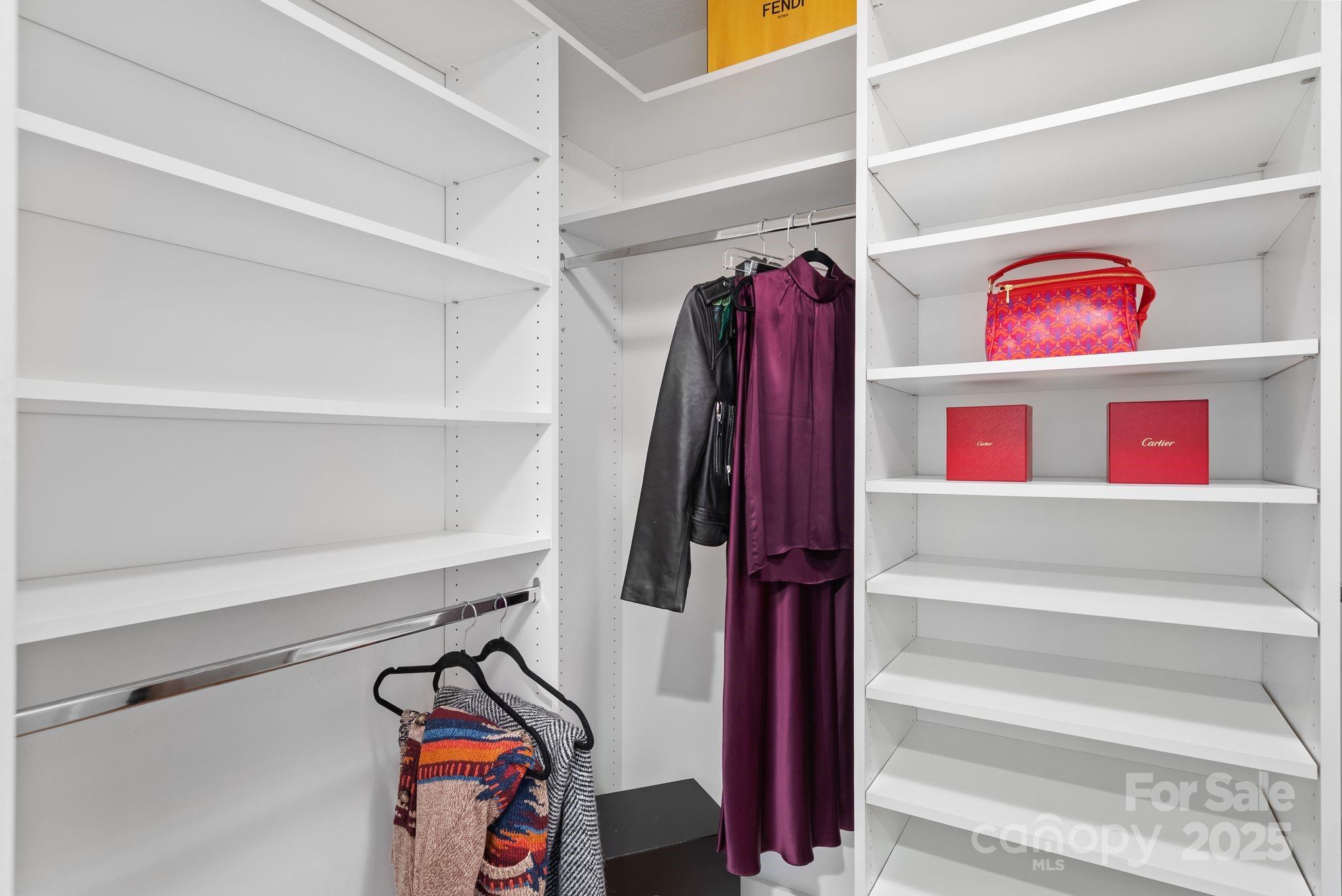 6 Sayles Town Road Fairview, NC 28730 - Photo 19 of 43 a view of walk in closet with clothes and shoes