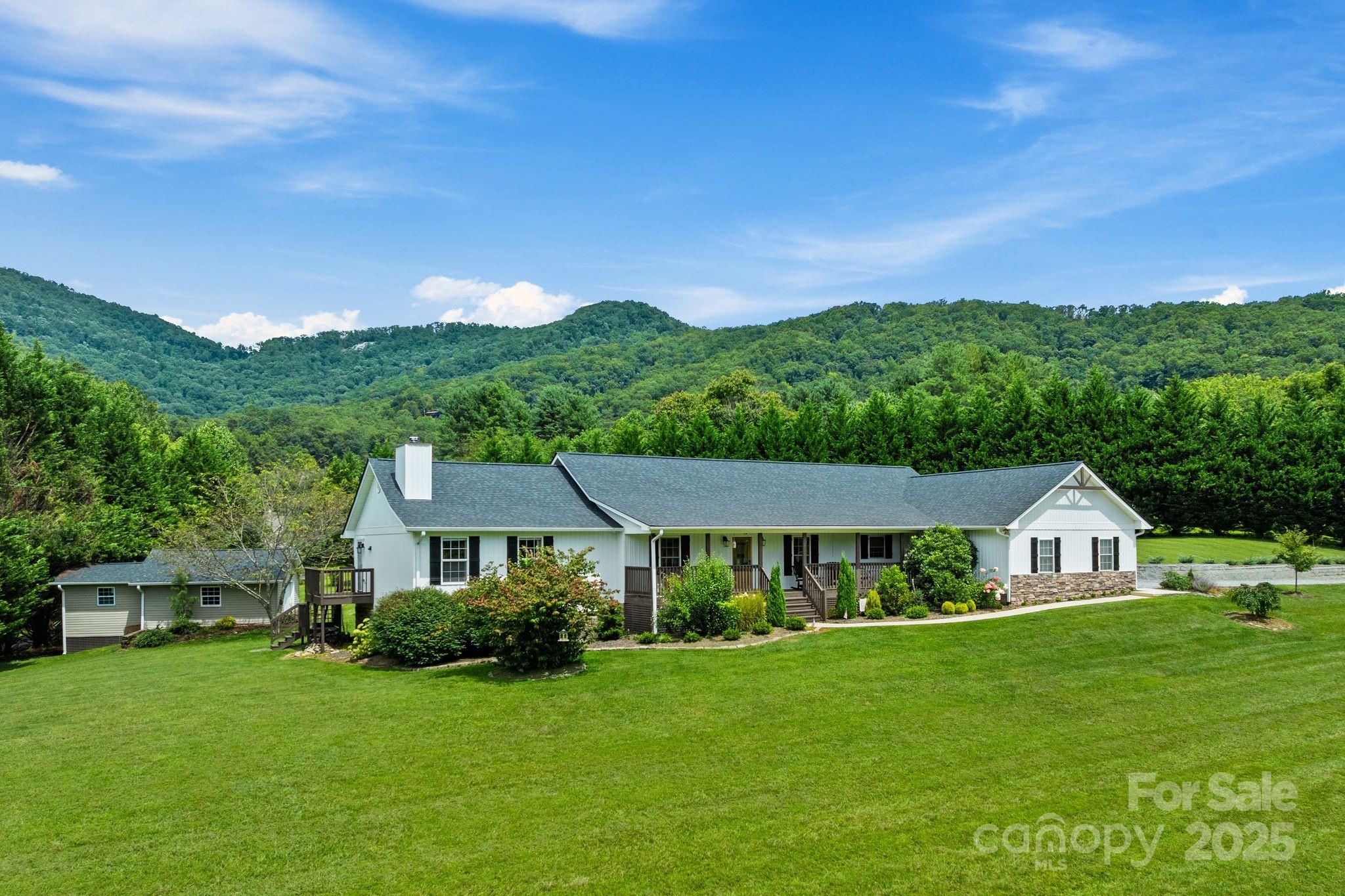 6 Sayles Town Road Fairview, NC 28730 - Photo 2 of 43 a front view of a house with a yard