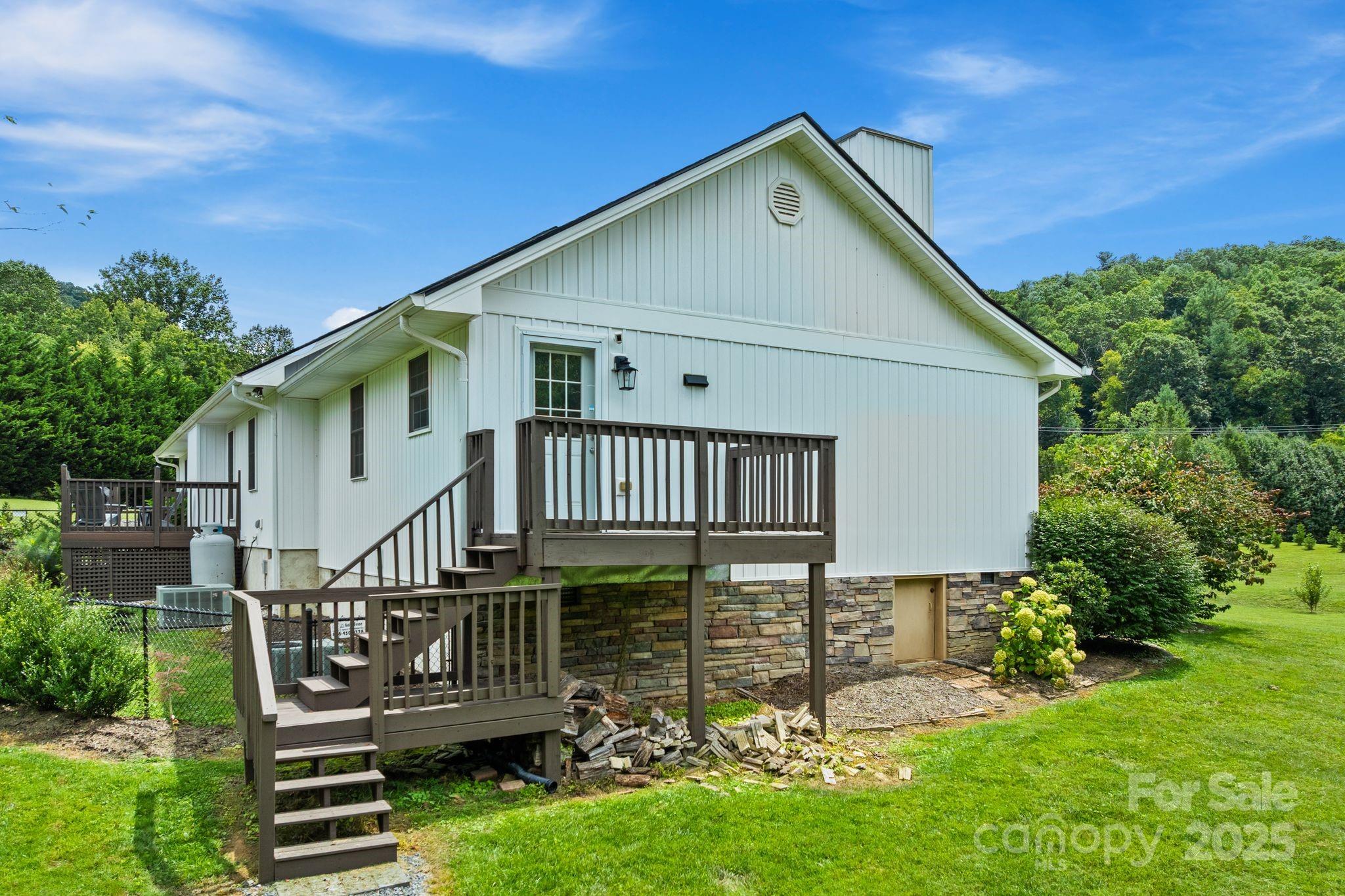 6 Sayles Town Road Fairview, NC 28730 - Photo 35 of 43 a front view of a house with garden