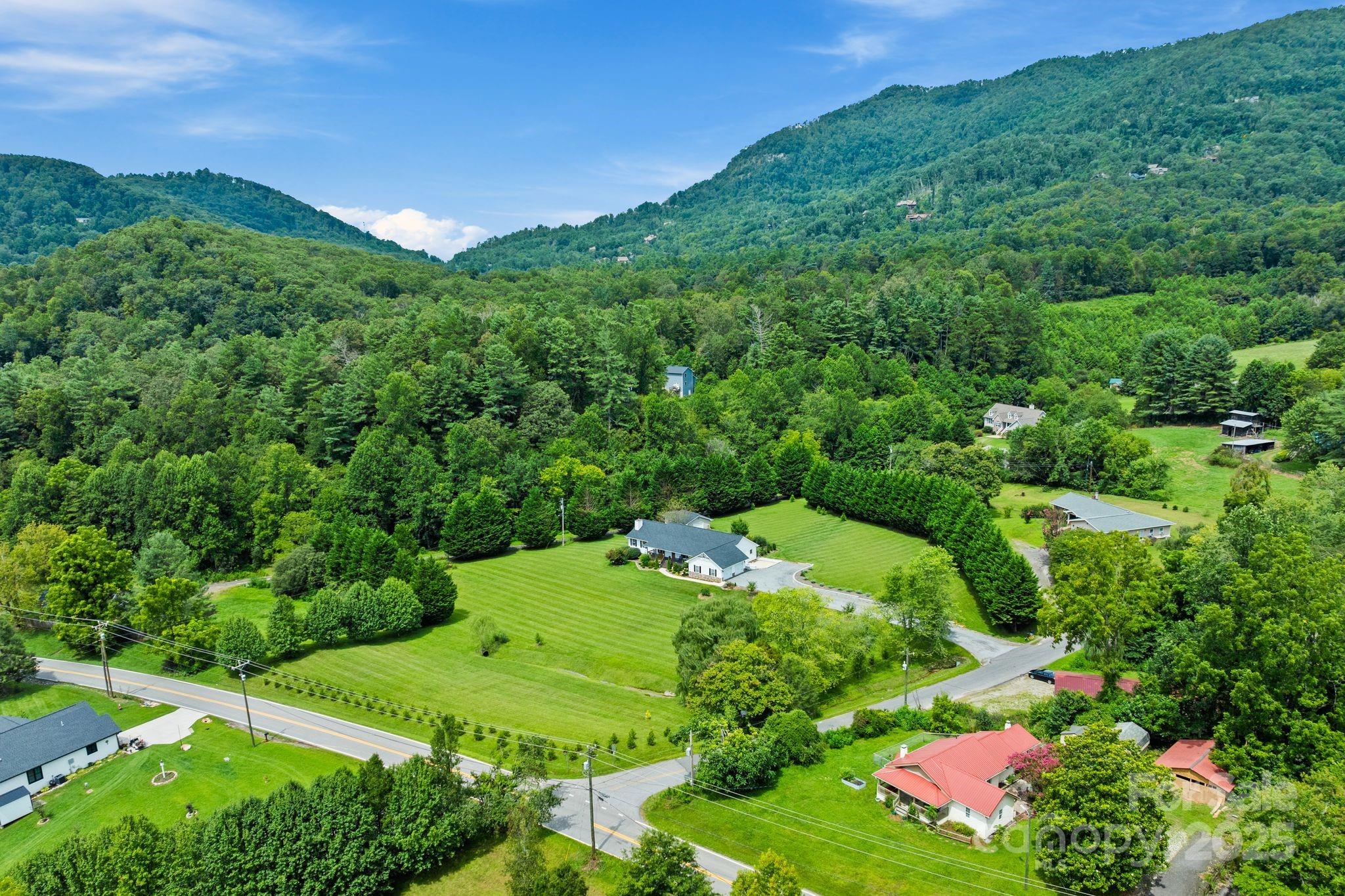 6 Sayles Town Road Fairview, NC 28730 - Photo 42 of 43 a view of a garden with a building in the background