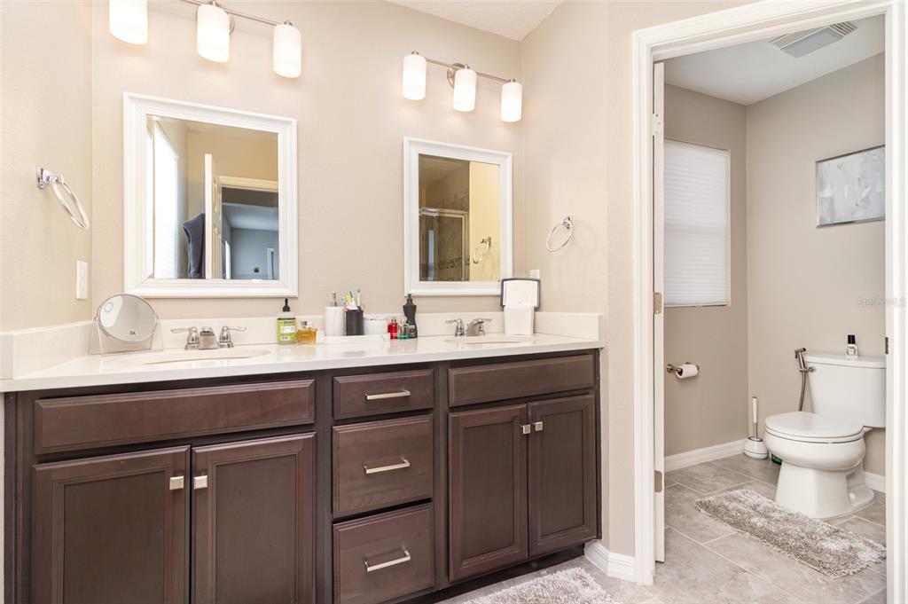 2461 Avian Loop Kissimmee, FL 34741 - Photo 17 of 36 a bathroom with a sink and a toilet