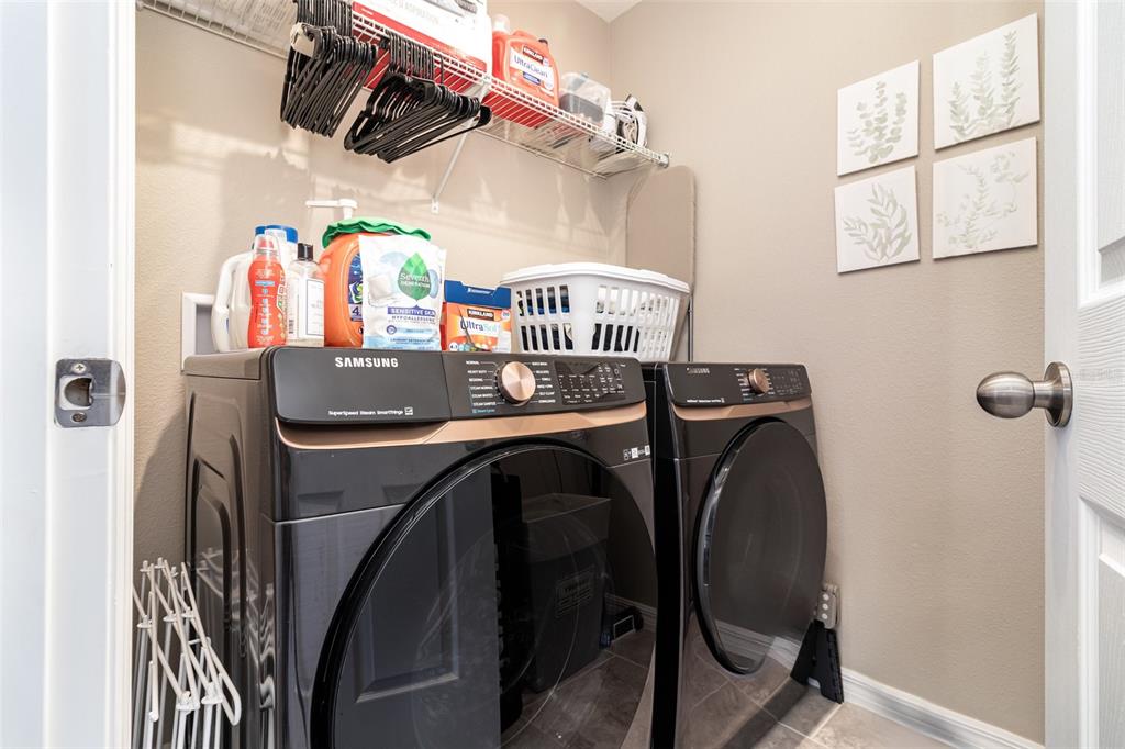 2461 Avian Loop Kissimmee, FL 34741 - Photo 24 of 36 a utility room with dryer and washer