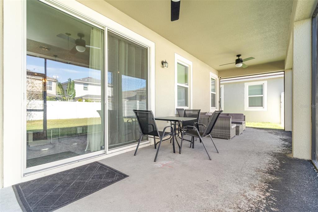 2461 Avian Loop Kissimmee, FL 34741 - Photo 25 of 36 a dining room with furniture and window