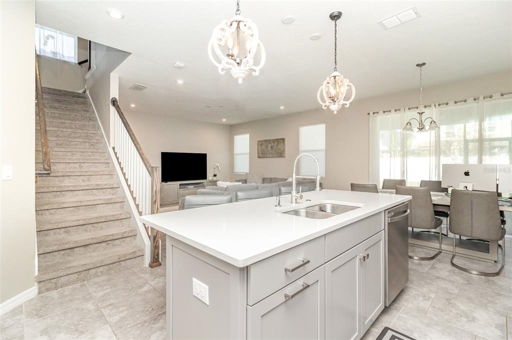 2461 Avian Loop Kissimmee, FL 34741 - Photo 8 of 36 a very nice looking dining room with a table and chairs