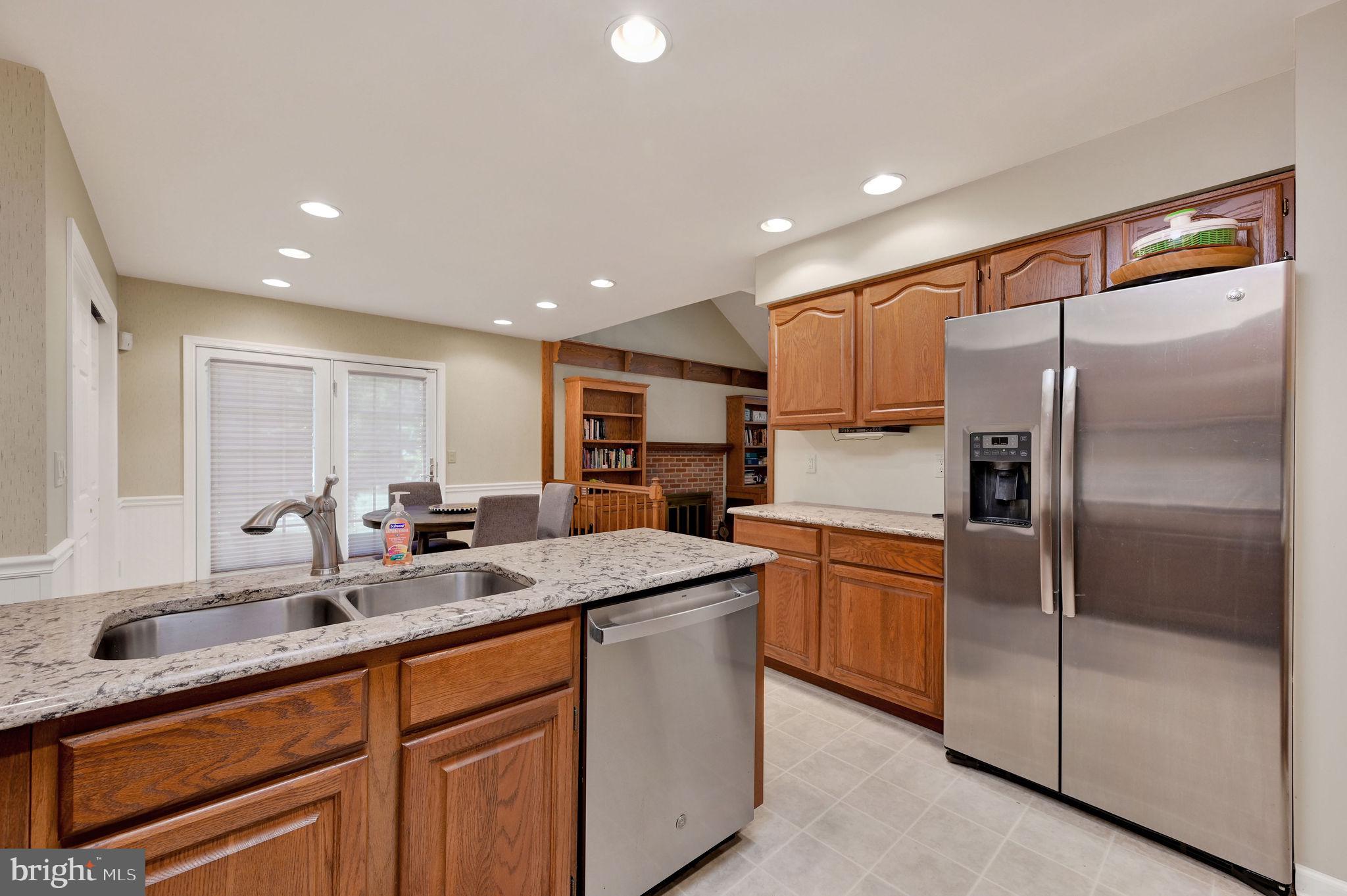 176 Burning Tree Road Dover, DE 19904 - Photo 18 of 33 Modern kitchen with warm wood accents.