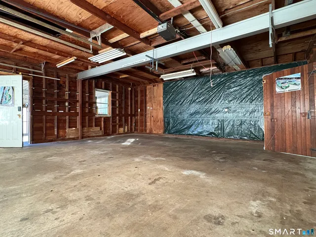 a view of a room with wooden walls
