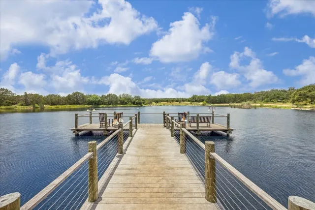 a view of a lake with houses in the back