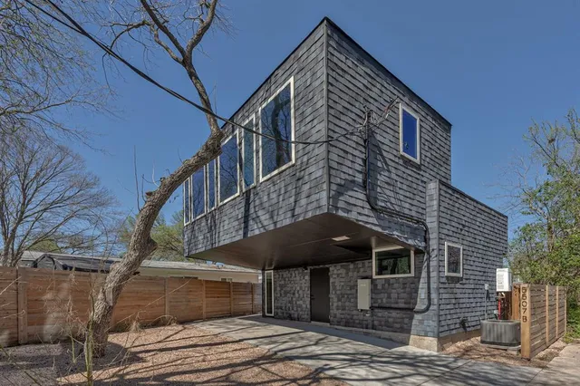 a front view of a building with large windows