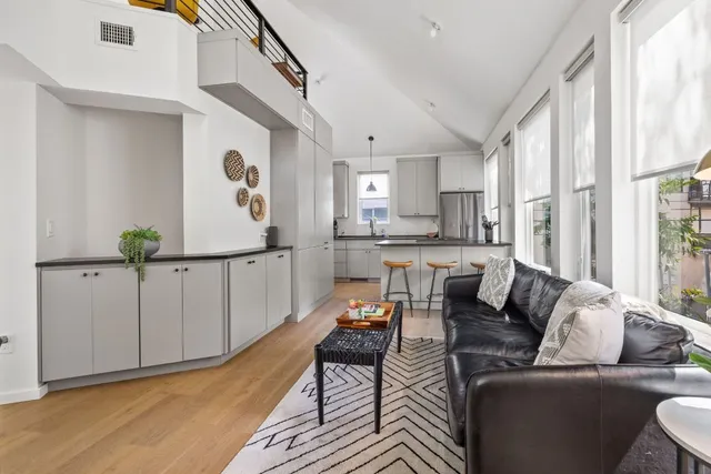 a kitchen with white cabinets and a sink
