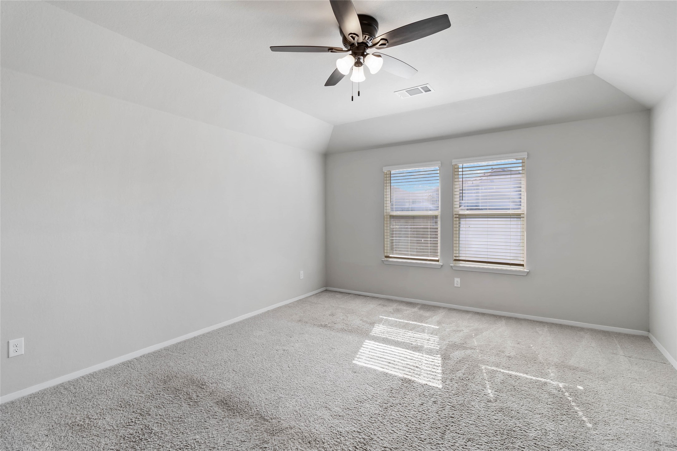 5613 Respinto Drive Austin, TX 78747 - Photo 29 of 38 an empty room with windows and fan