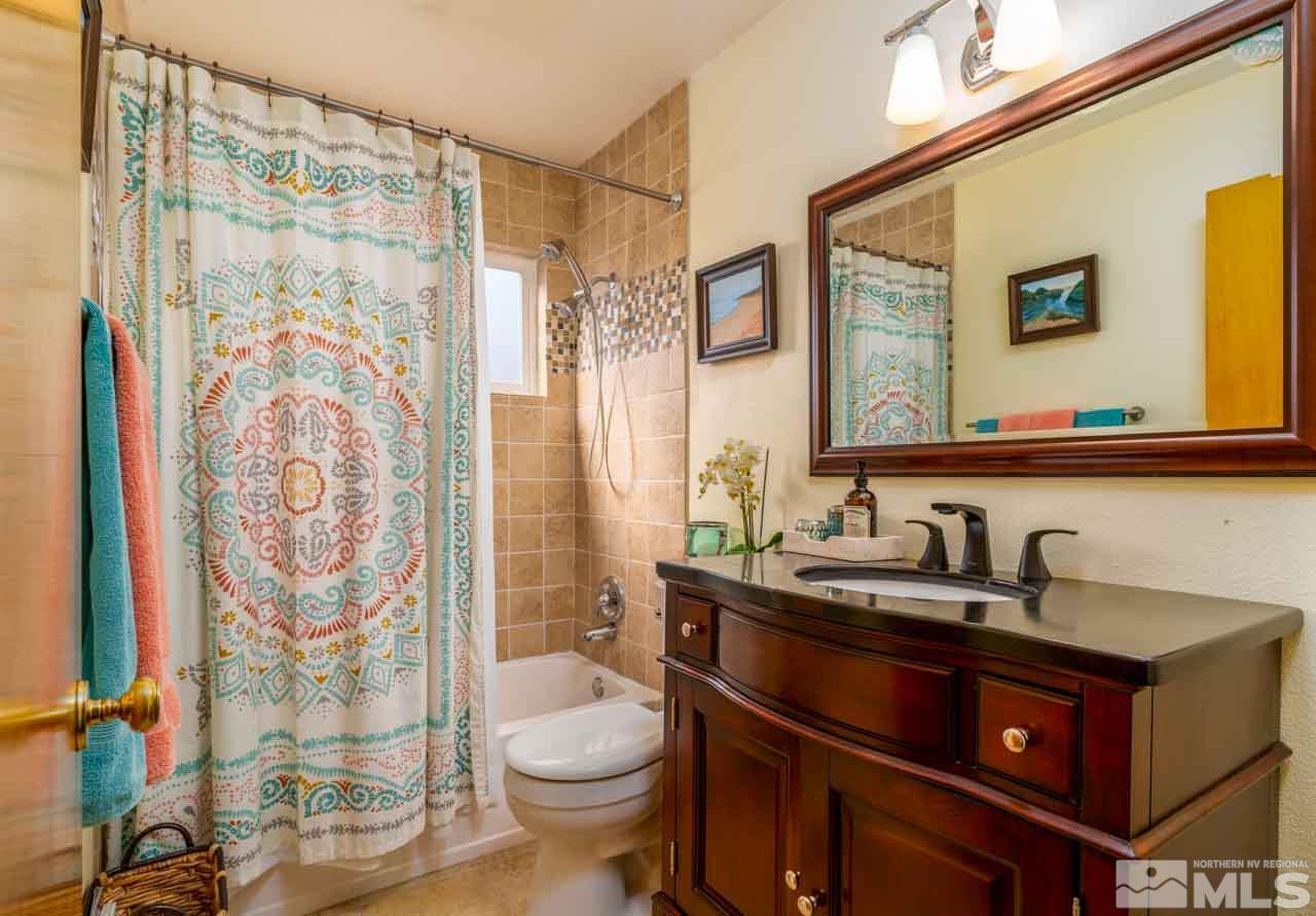655 Amber Circle Reno, NV 89509 - Photo 15 of 31 a bathroom with a sink toilet and shower