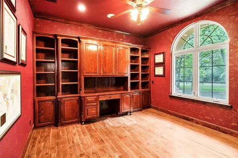 a bathroom with a sink mirror and toilet