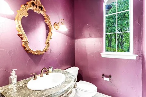 a bedroom with furniture window and a ceiling fan