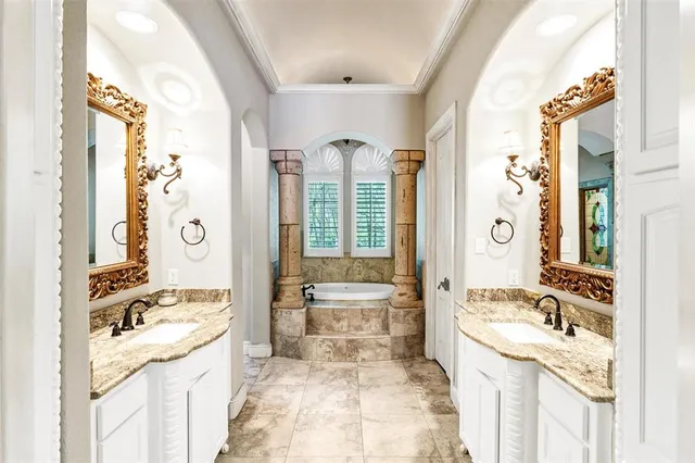 a living room with pool table flat screen tv and windows