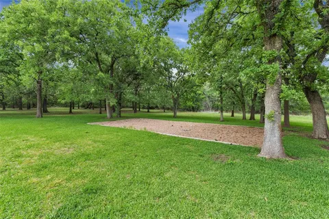 a view of a tree in front of a house