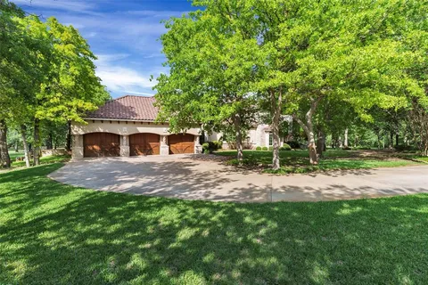 a aerial view of a house with a yard