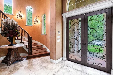 a living room with furniture fireplace and flat screen tv