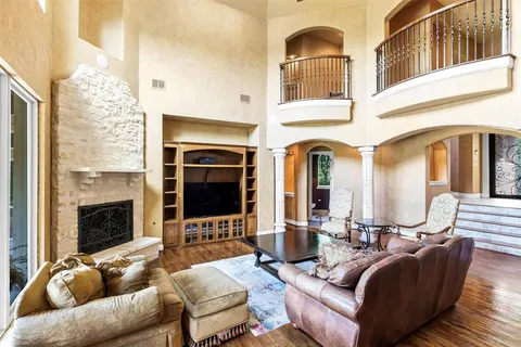 a living room with furniture fireplace and flat screen tv
