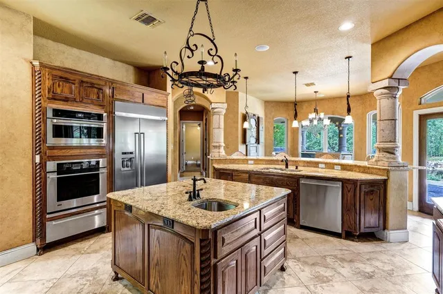 a view of a dining room with furniture wooden floor and chandelier