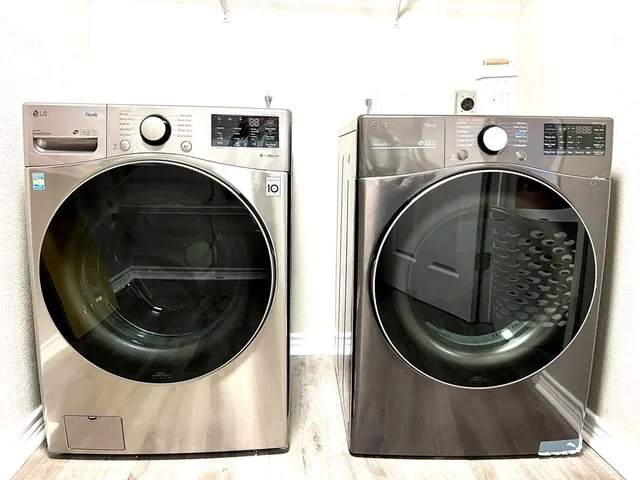 a bathroom with a double vanity sink a mirror and shower