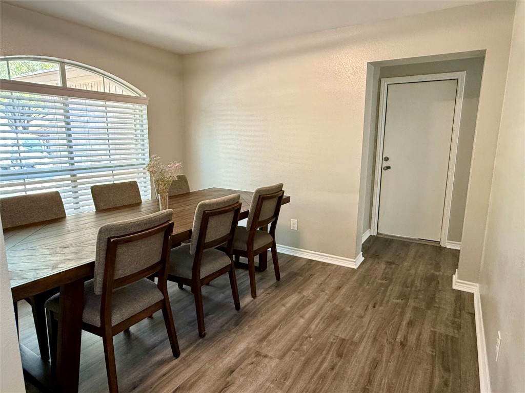 1002 Port Daniel Drive Leander, TX 78641 - Photo 5 of 12 a view of a dining room with furniture and wooden floor