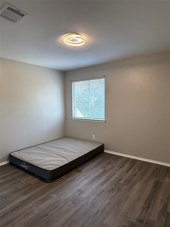 1002 Port Daniel Drive Leander, TX 78641 - Photo 8 of 12 a bedroom with a bed and a window