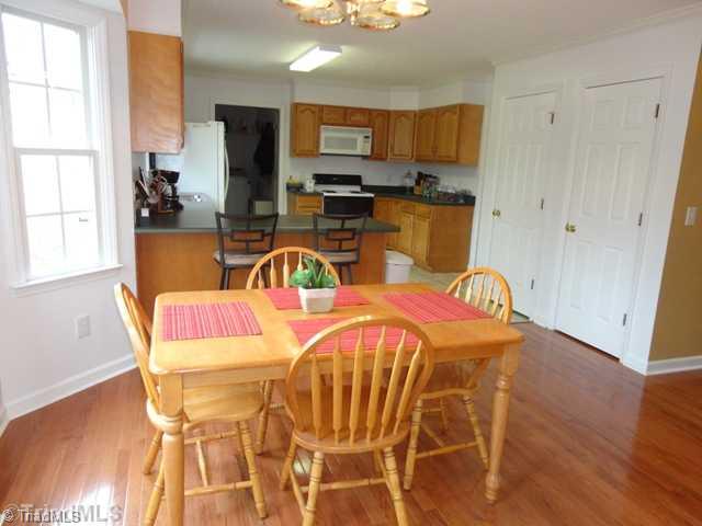 175 Creekside Ridge Drive High Point, NC 27265 - Photo 16 of 16 Breakfast. Open Floor Plan with view into kitchen with bar seating.