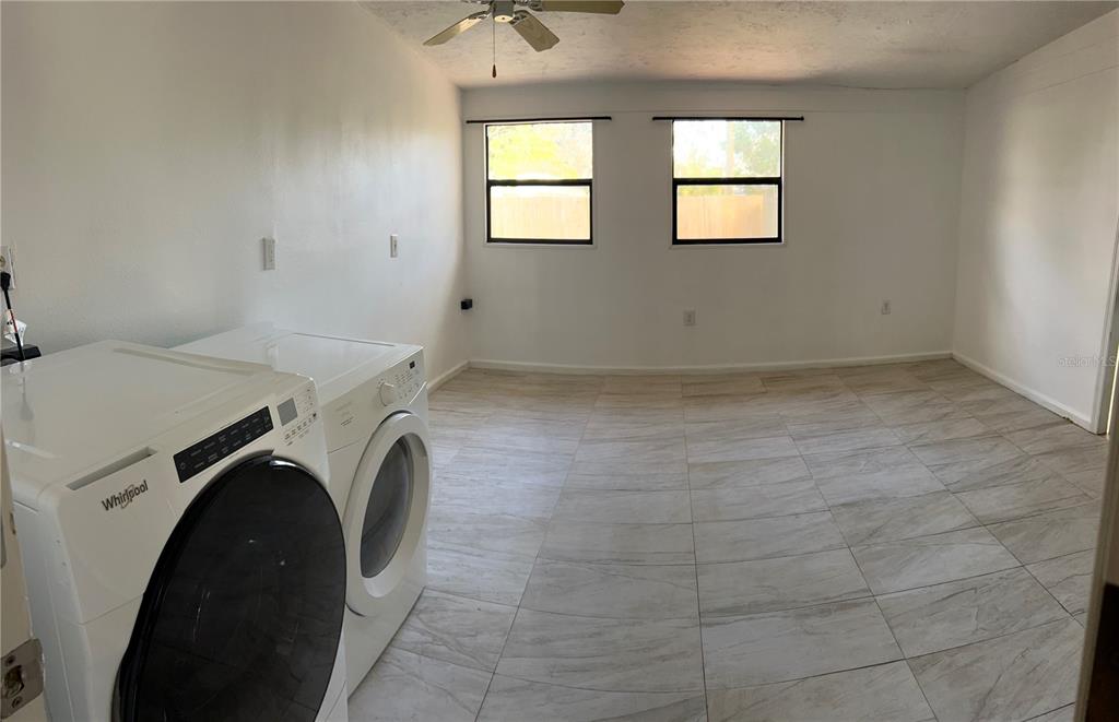 3635 Lalani Boulevard Sarasota, FL 34232 - Photo 20 of 24 a utility room with dryer and washer