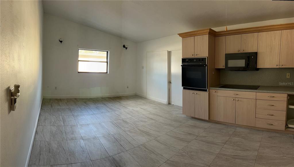 3635 Lalani Boulevard Sarasota, FL 34232 - Photo 2 of 24 a view of a kitchen with electric appliances