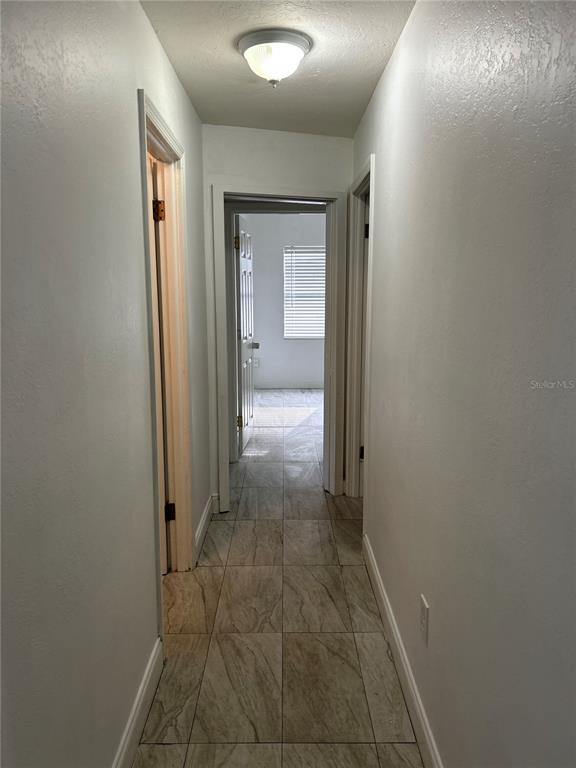 3635 Lalani Boulevard Sarasota, FL 34232 - Photo 21 of 24 a view of a hallway