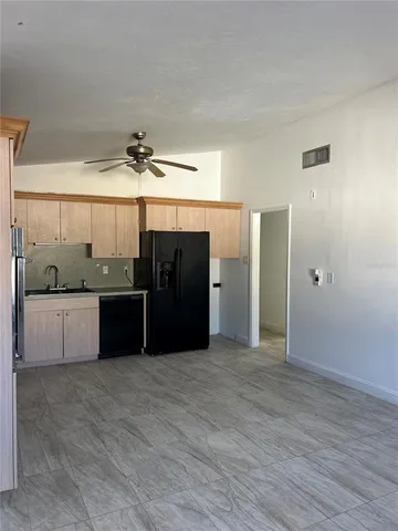 a view of a kitchen with a sink