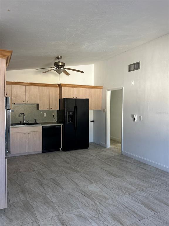 3635 Lalani Boulevard Sarasota, FL 34232 - Photo 6 of 24 a view of a kitchen with a sink