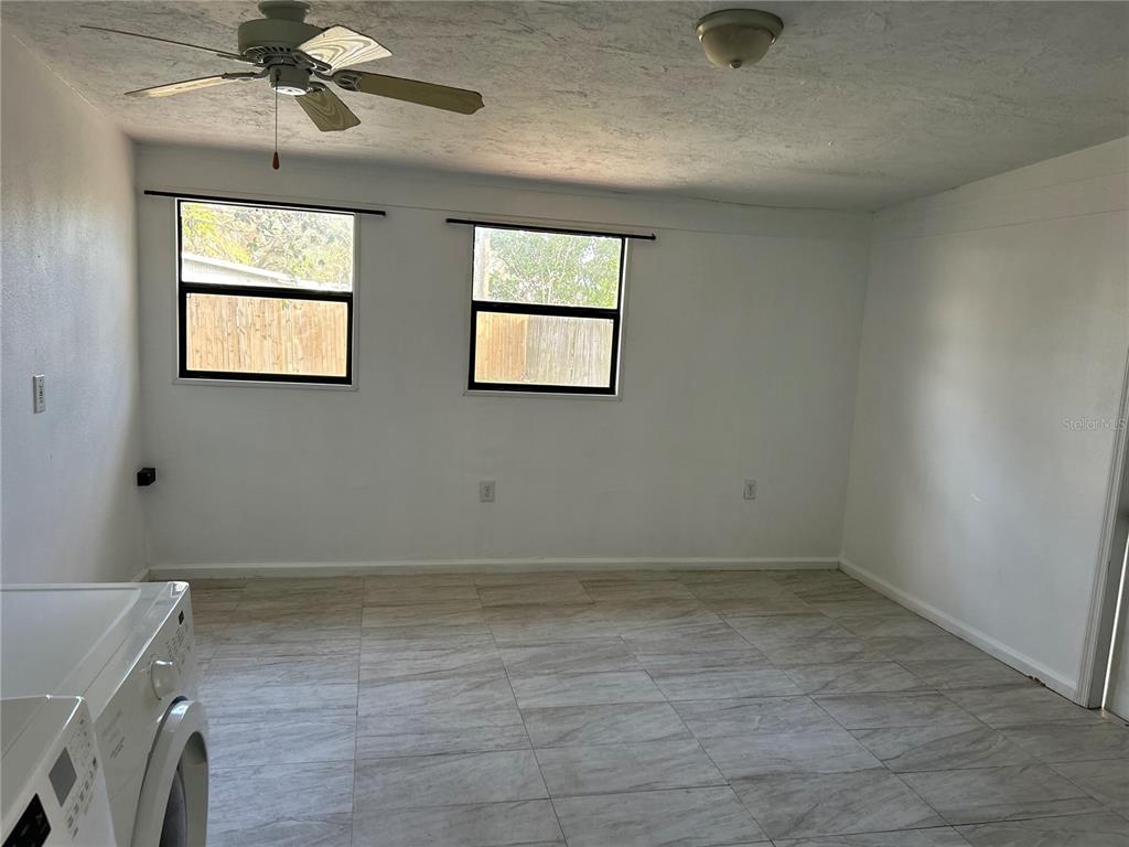 3635 Lalani Boulevard Sarasota, FL 34232 - Photo 9 of 24 en empty room with windows