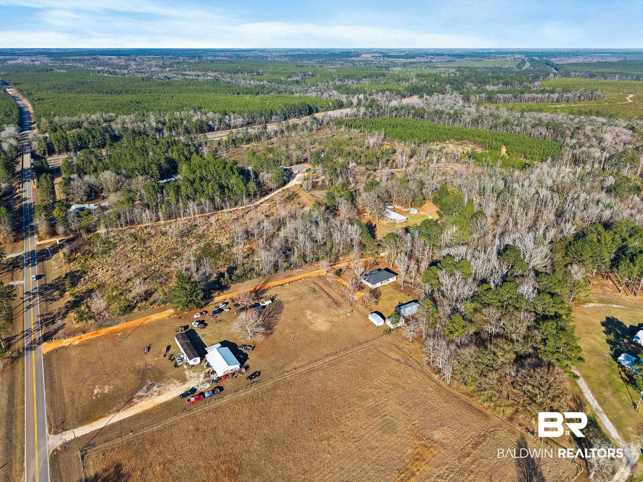 55750 Lottie Road Perdido, AL 36562 - Photo 9 of 84 Aerial view of property and surrounding area featuring rural landscape