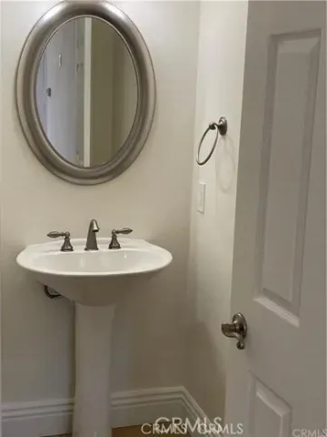 a bathroom with a sink and mirror