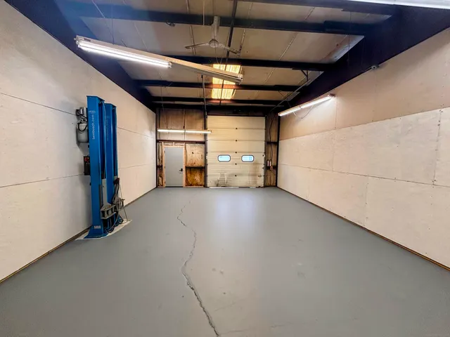 a view of empty room with white walls