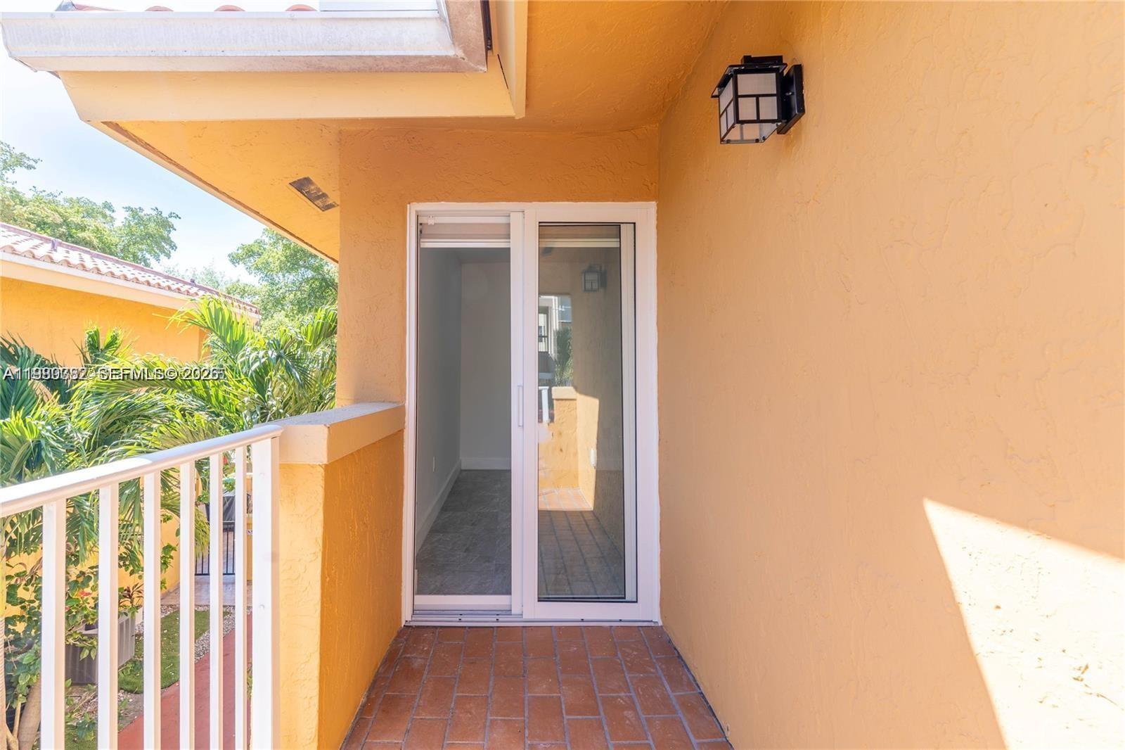 13900 Southwest 65th Terrace, Unit 9 Miami, FL 33183 - Photo 14 of 19 a view of a door and wooden floor