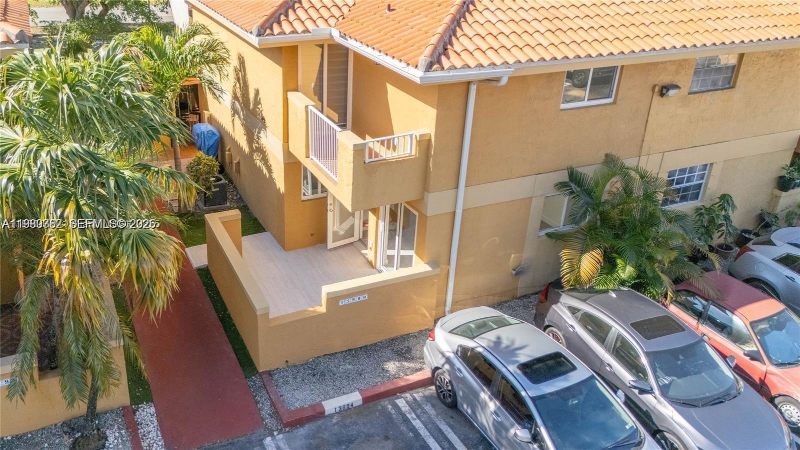 13900 Southwest 65th Terrace, Unit 9 Miami, FL 33183 - Photo 15 of 19 a view of an outdoor space with seating area