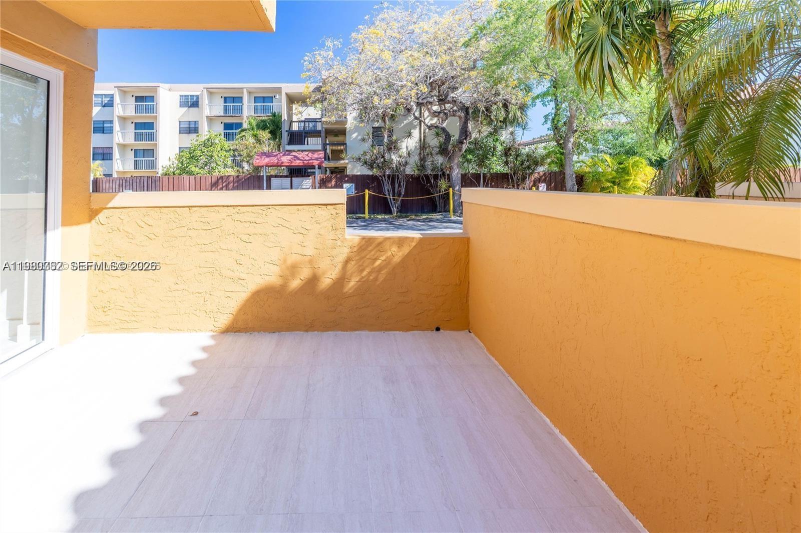 13900 Southwest 65th Terrace, Unit 9 Miami, FL 33183 - Photo 16 of 19 a view of swimming pool with seating area