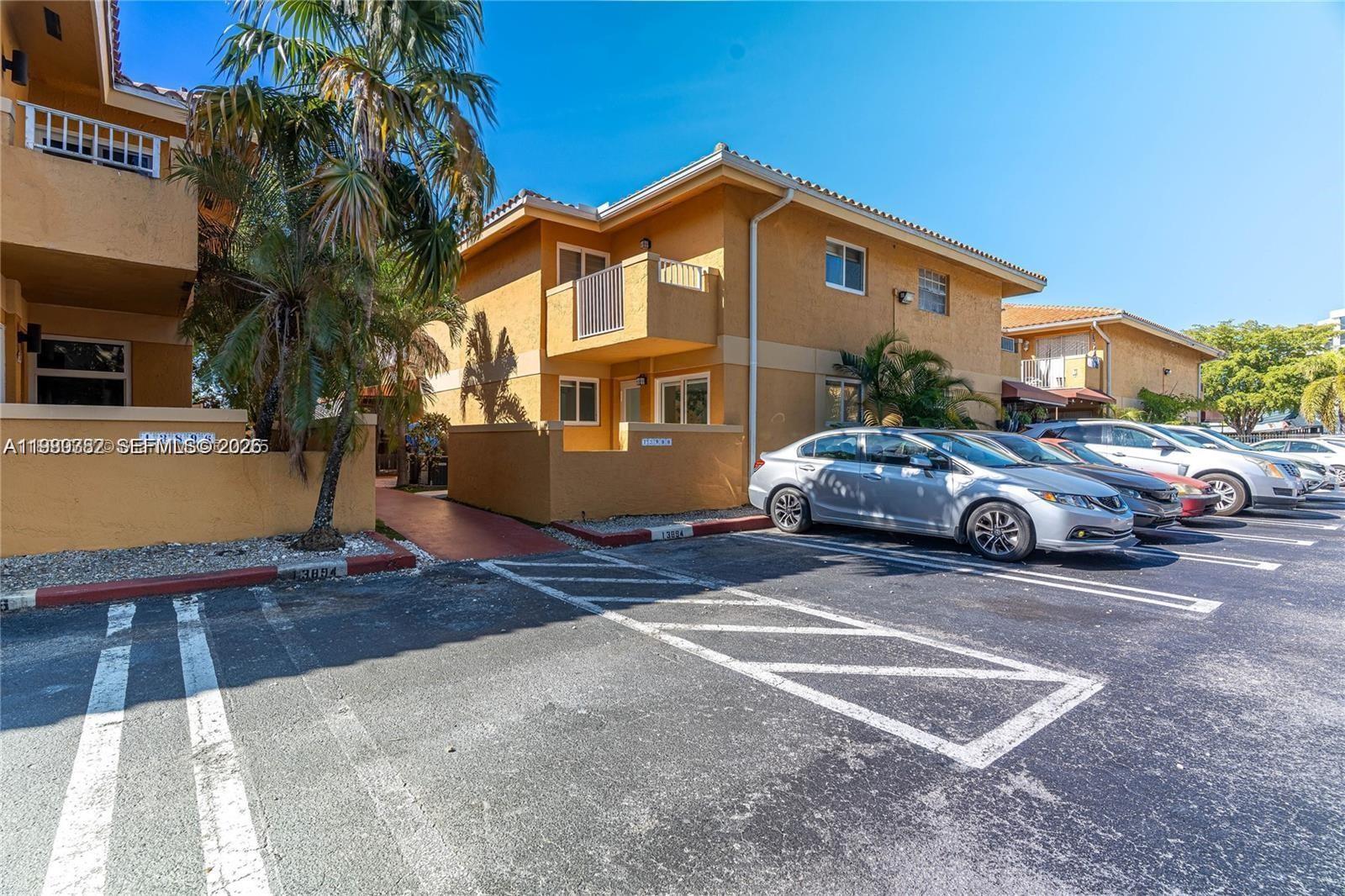 13900 Southwest 65th Terrace, Unit 9 Miami, FL 33183 - Photo 17 of 19 a view of a car park in front of house