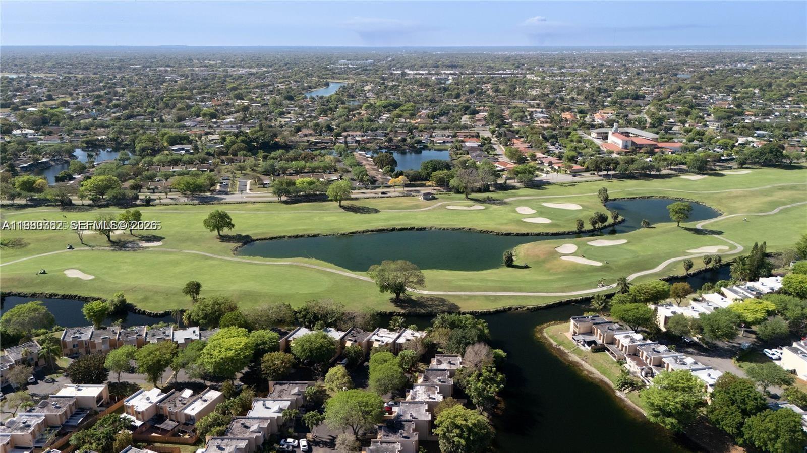 13900 Southwest 65th Terrace, Unit 9 Miami, FL 33183 - Photo 19 of 19 a view of a lake with a field