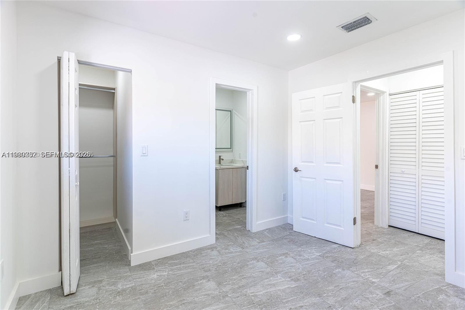 13900 Southwest 65th Terrace, Unit 9 Miami, FL 33183 - Photo 7 of 19 an empty room with windows