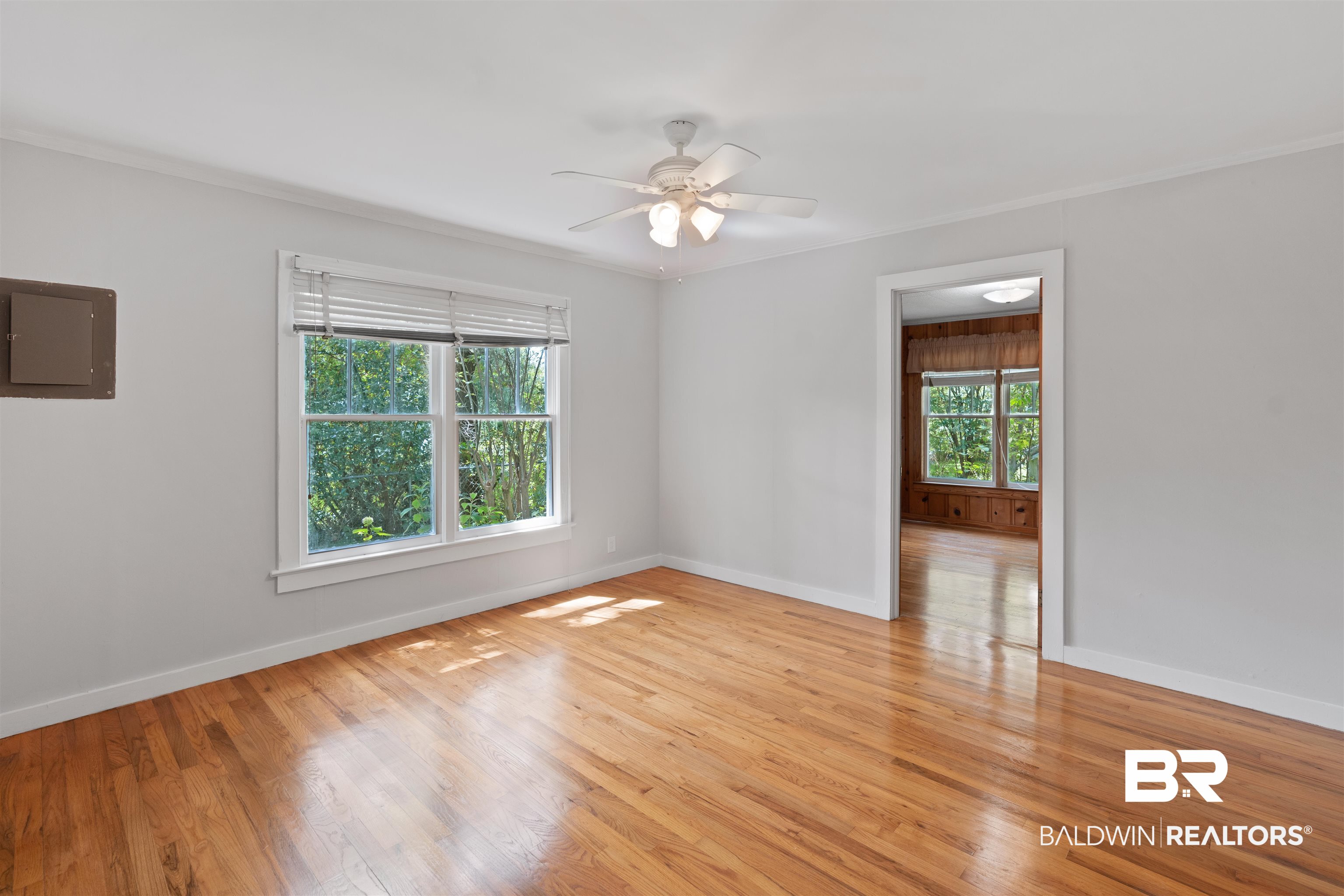 2126 Barron Place Mobile, AL 36605 - Photo 16 of 33 Spare room with ceiling fan, crown molding, light hardwood / wood-style floors, and electric panel