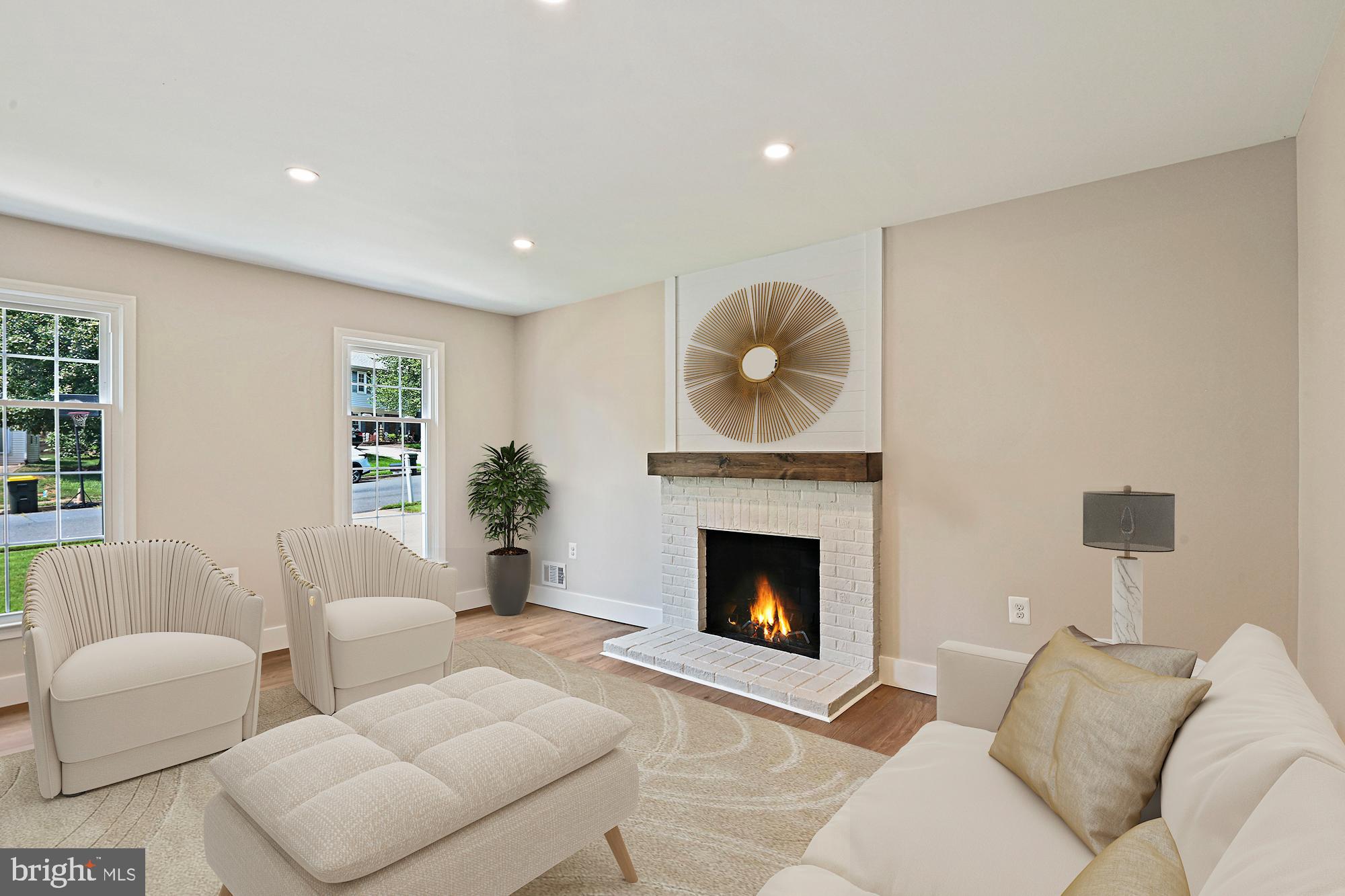 9060 Brook Ford Road Burke, VA 22015 - Photo 14 of 56 a living room with furniture a fireplace with wooden floor