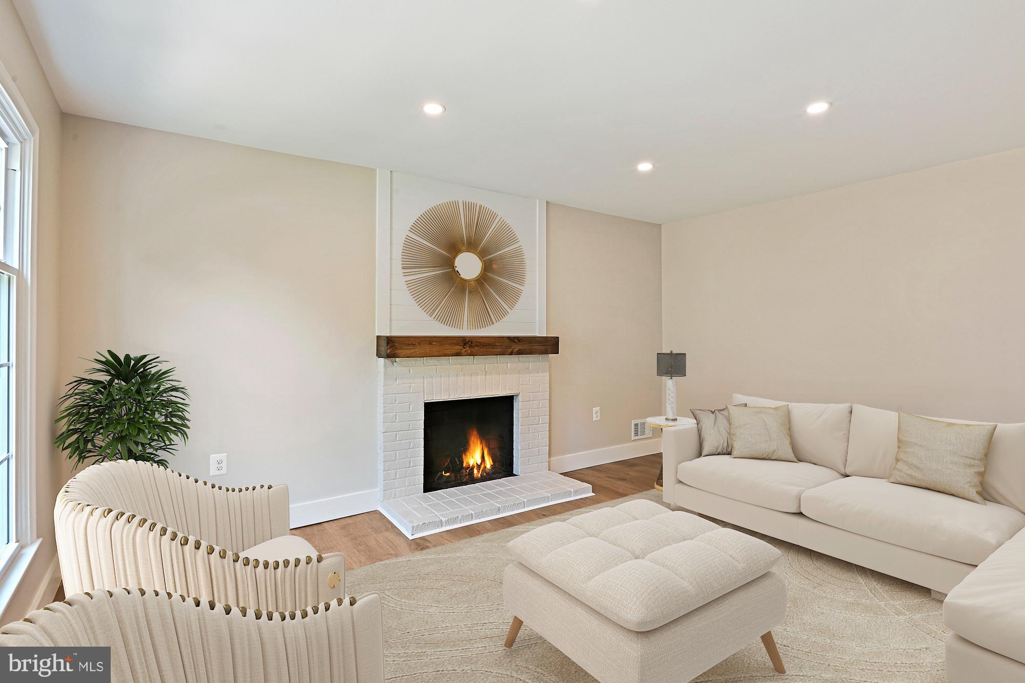 9060 Brook Ford Road Burke, VA 22015 - Photo 16 of 56 a living room with furniture and a fireplace