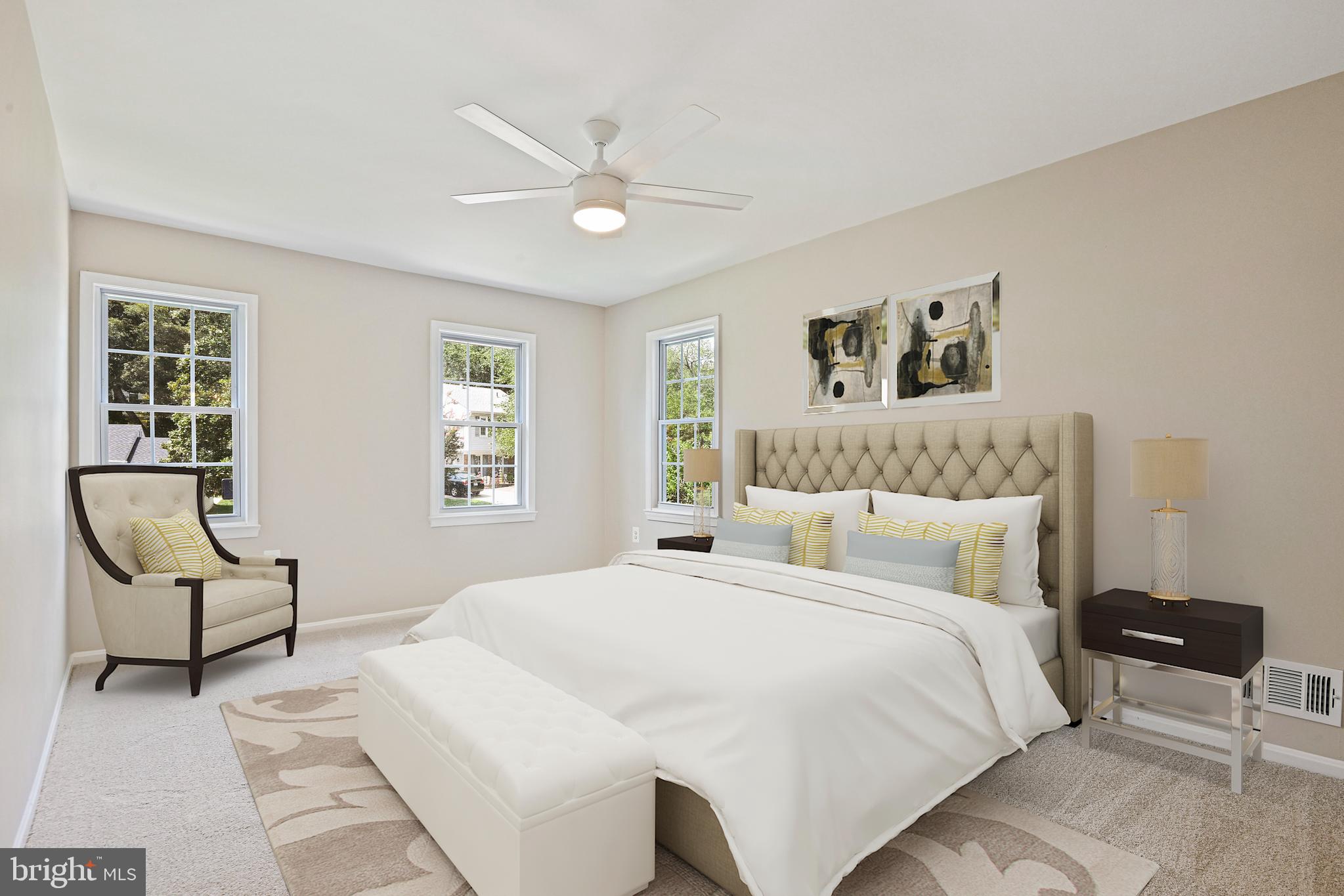 9060 Brook Ford Road Burke, VA 22015 - Photo 21 of 56 a bedroom with a large bed and a chair