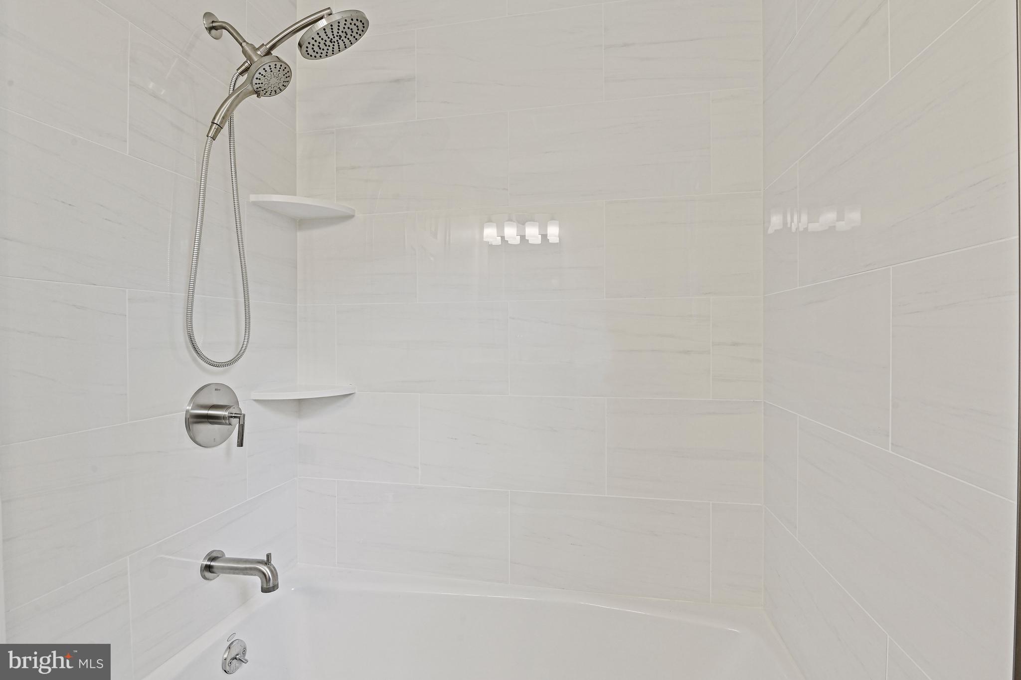 9060 Brook Ford Road Burke, VA 22015 - Photo 38 of 56 a bathroom with a shower