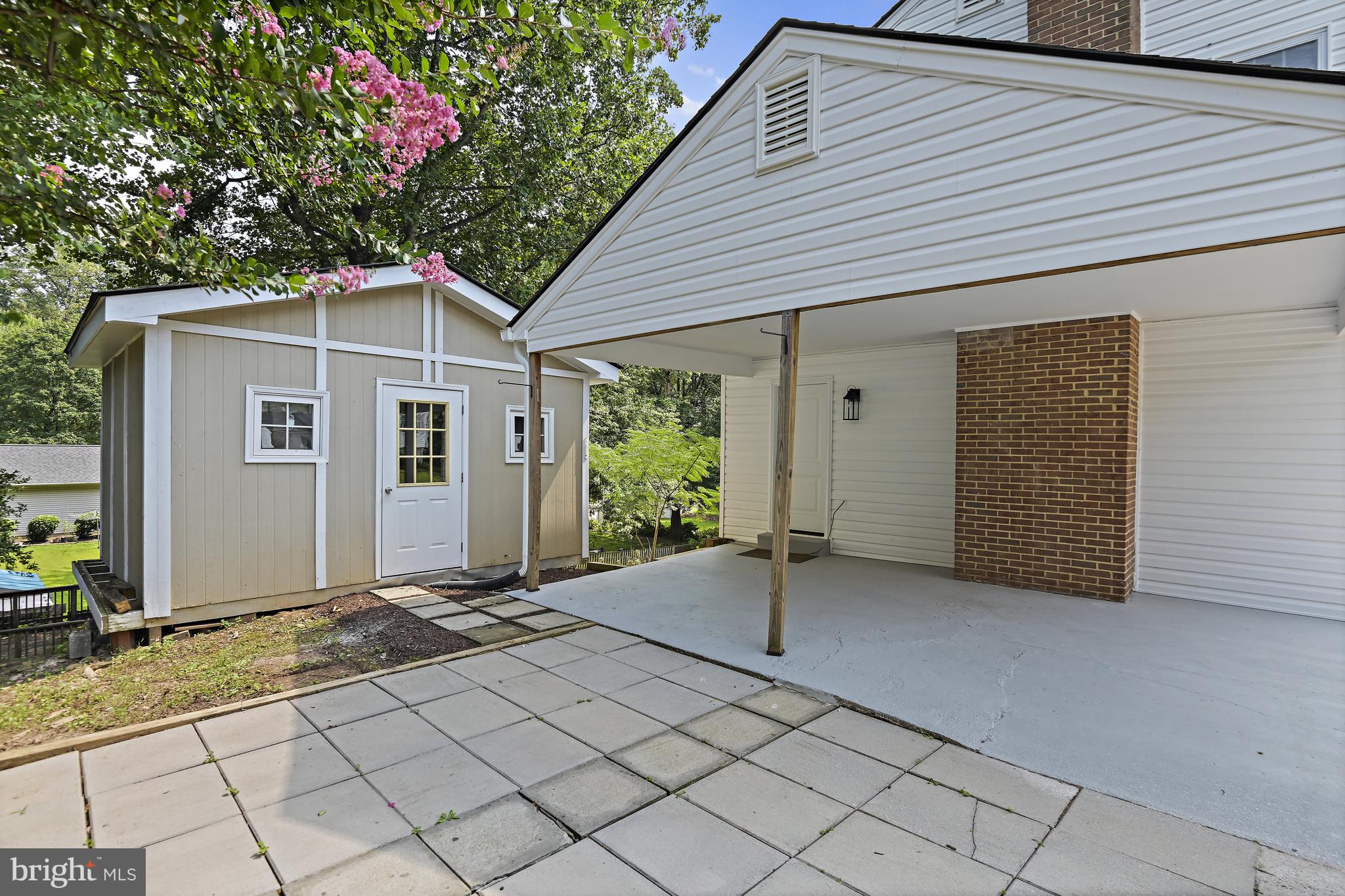 9060 Brook Ford Road Burke, VA 22015 - Photo 48 of 56 a view of a house with a small backyard