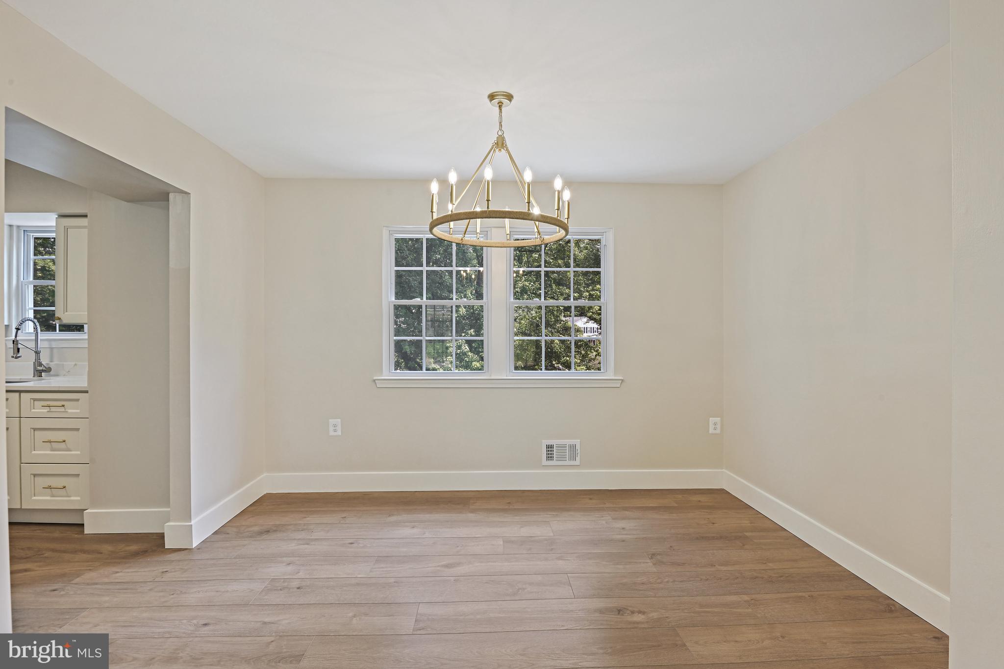 9060 Brook Ford Road Burke, VA 22015 - Photo 8 of 56 wooden floor in an empty room with a window